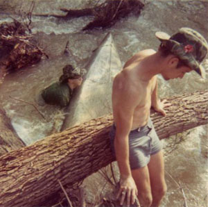 John Woodside (in water) and Skip Evans after they swamped their canoe on the Buffalo.